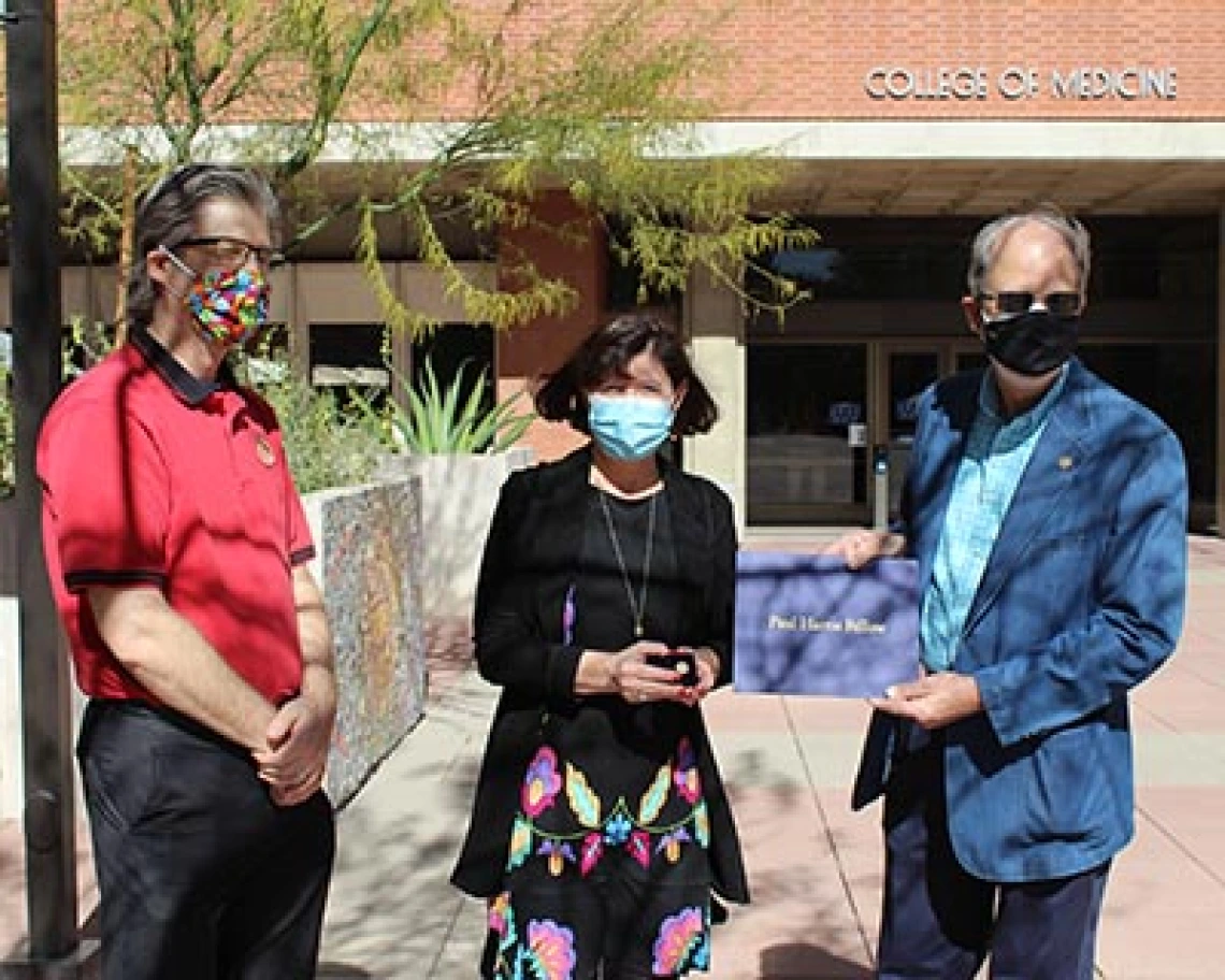 Photo From left: Georg Haubner, Rotary Club of Tucson Sunrise president, Monica Kraft, MD, and Rick Hallick, PhD, the club’s Rotary Foundation director.